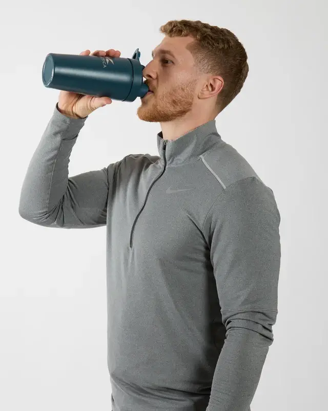 Dom Oddy holding a drink bottle.